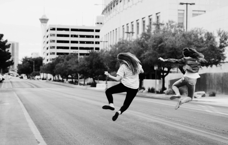 happy-ladies-jumping-in-street-neonbrand-603284-unsplash-785x500-1